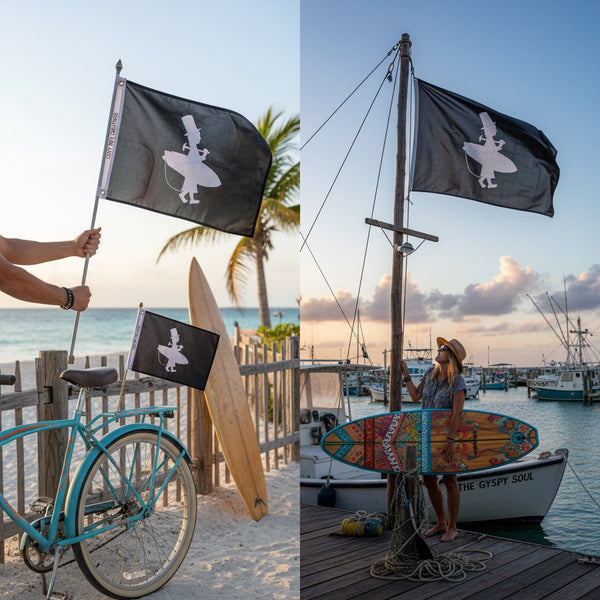 Lost Boy Creations Hoist the Colors black embroidered flag featuring a white surfer silhouette logo on a boat dock.