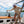 Lost Boy Creations Hokulea hat with Hawaiian floral print and white mesh back worn by a woman sailing on a boat in Key West Florida | Lost Boy Creations Key West