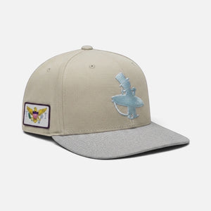 Vanilla Ice Hat in Ivory — side flat lay, metallic blue LBC logo with USVI flag patch | Lost Boy Creations Key West