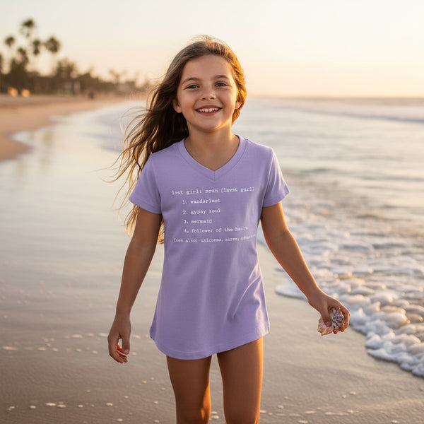 Kid's Lost Girl Tee in Lavender — lifestyle, girl wearing tee with Lost Girl graphic on the beach | Lost Boy Creations Key West