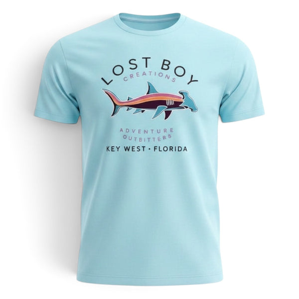 Lost Boy Creations light blue crew neck t-shirt featuring a colorful hammerhead shark graphic on the chest.