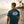 Men's Original Adventure Gear Tee in Marine Blue — lifestyle, man wearing tee with Original Adventure Gear back graphic at sunset | Lost Boy Creations Key West