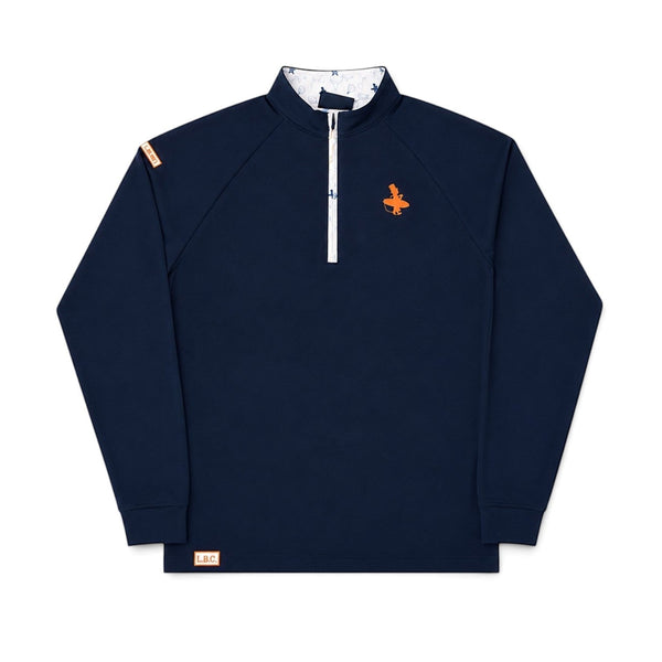 LBC Golf 1/4 Zip navy front flat lay with orange Lost Boy surfer logo on left chest, white zip placket, and Key West vibe patterned inner collar | Lost Boy Creations Key West