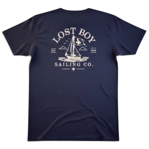 Lost Boy Creations midnight navy cotton t-shirt featuring a white sailing boat graphic on the back