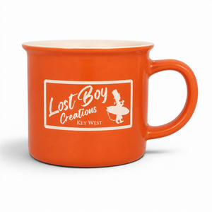 Lost Boy Creations orange ceramic campfire mug with a cream interior and a retro Key West logo on the front.