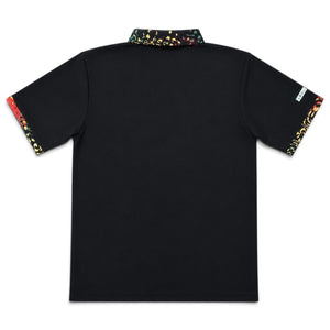 Rasta Golf Polo black back flat lay with Rasta-print collar and multicolor sleeve cuffs in red yellow and green | Lost Boy Creations Key West