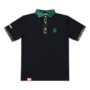 Rasta Golf Polo black front flat lay with green Lost Boy Creations logo on left chest and Rasta-print collar and sleeve cuffs in red yellow and green | Lost Boy Creations Key West