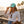 Flamingo Flats Low-Pro Hat in Mint — lifestyle, woman wearing hat with LBC surfer embroidery on a boardwalk at sunset | Lost Boy Creations Key West