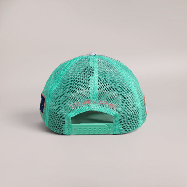 Back view of Lost Boy Creations Coral Cruiser snapback hat featuring seafoam green mesh and embroidered text.