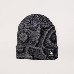 Lost Boy Creations smoke grey heathered rib-knit beanie with a branded patch on the fold-over cuff.