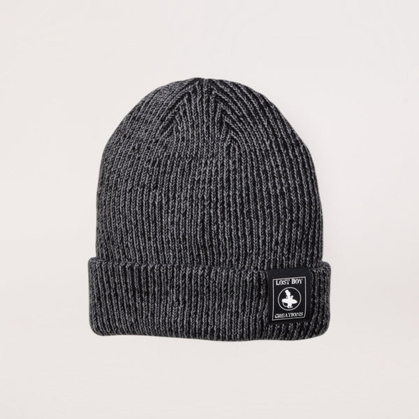 Lost Boy Creations smoke grey heathered rib-knit beanie with a branded patch on the fold-over cuff.