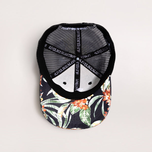 Lost Boy Creations Tarzan snapback hat showing the floral print underbrim and interior mesh construction
