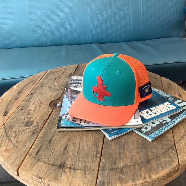 Lost Boy Creations Coral Reefer snapback hat with teal front, orange brim, and orange mesh back on a wooden table.