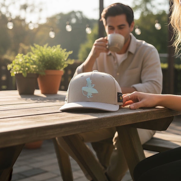 Vanilla Ice Hat in Ivory — lifestyle worn shot, icy blue embroidered LBC logo | Lost Boy Creations Key West