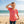 Kid's Lost Girl Tee in Watermelon — lifestyle, girl wearing tee with Lost Girl graphic on the beach | Lost Boy Creations Key West
