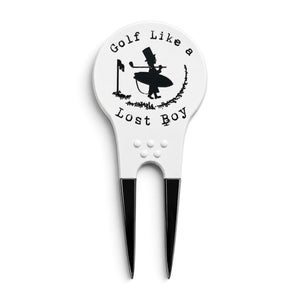 Lost Boy Creations white divot tool with black metal prongs and Golf Like a Lost Boy graphic on the front