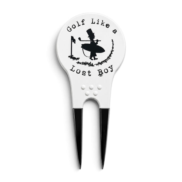 Lost Boy Creations white divot tool with black metal prongs and Golf Like a Lost Boy graphic on the front