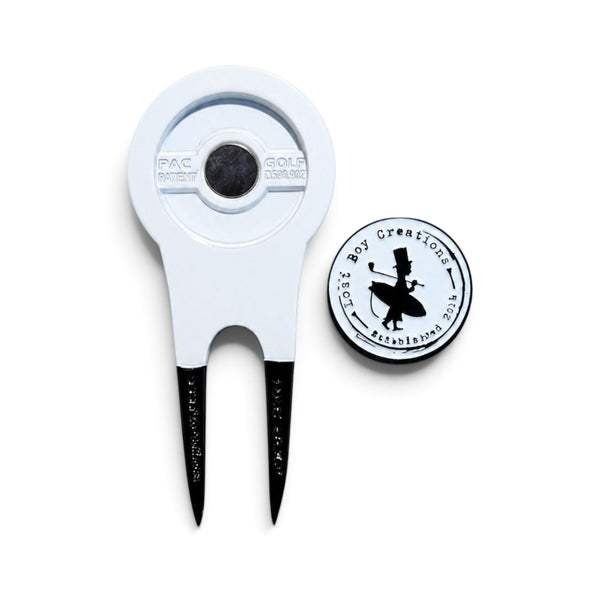 Lost Boy Creations white divot tool with black metal prongs and a matching magnetic ball marker featuring LBC logo.