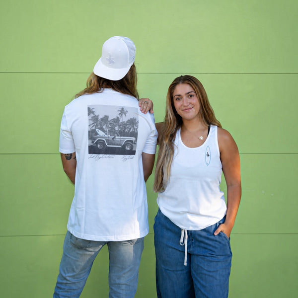 Lost Boy Creations white Bronco Tee 2.0 with back graphic of a vintage SUV, worn by a man and a woman.