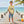 Kid's Silver King Tee lemon yellow lifestyle shot worn by boy on a wooden pier with tropical beach backdrop and colorful tarpon graphic | Lost Boy Creations Key West